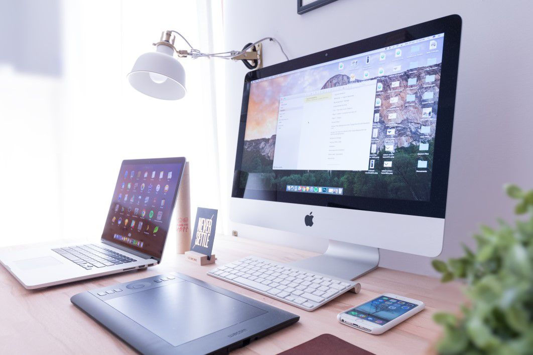 a desk with computers on it